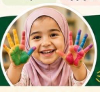Happy preschooler showing colorful paint-covered palms